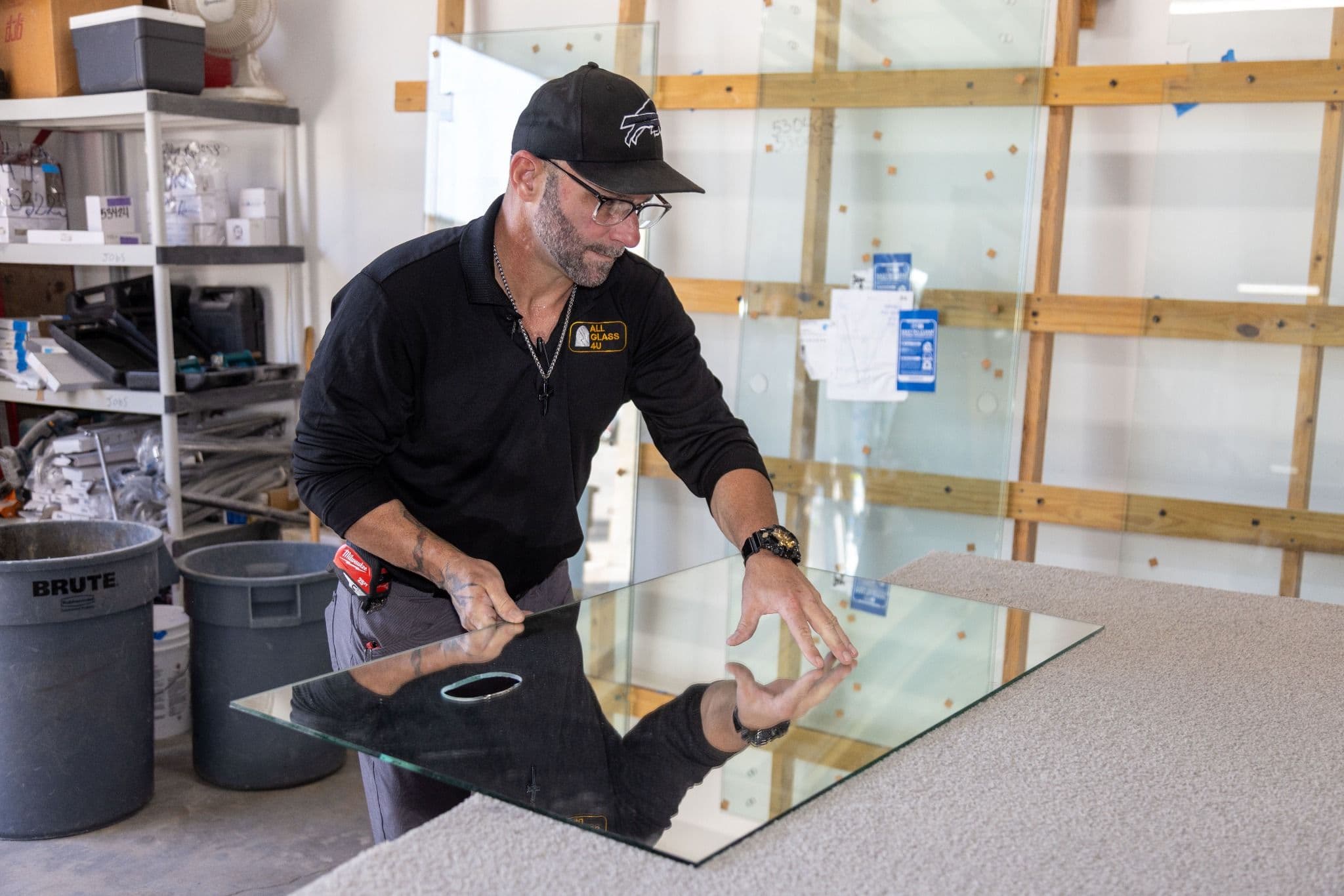 Cutting a glass panel to size in the All Glass 4 U shop in Stuart