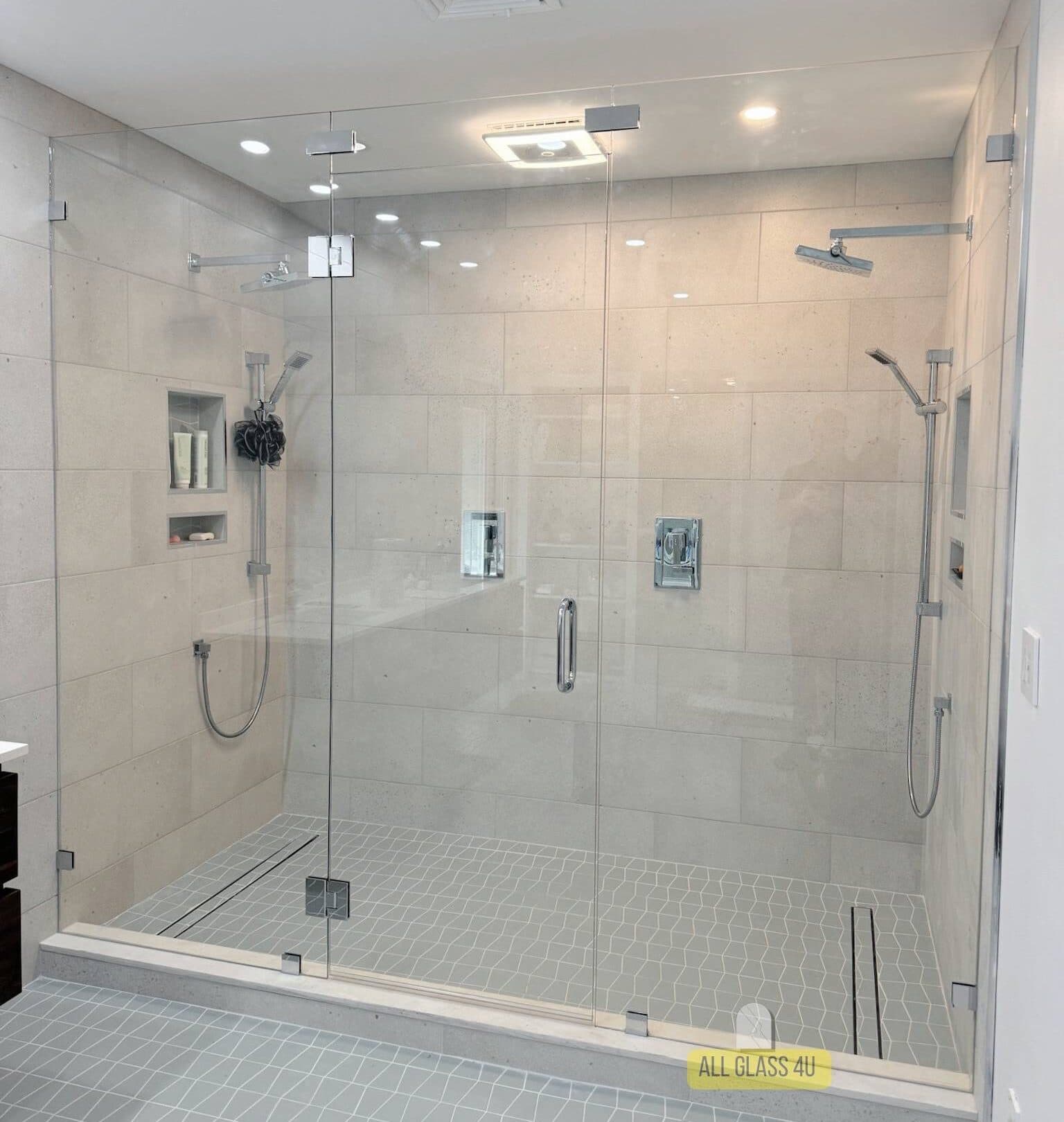 Frameless glass shower enclosure with walk-in panel and door